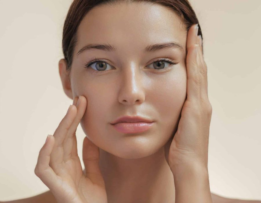 Anti Aging Treatment and Facelift Skin Care Concept. Woman with hand on cheek and eye